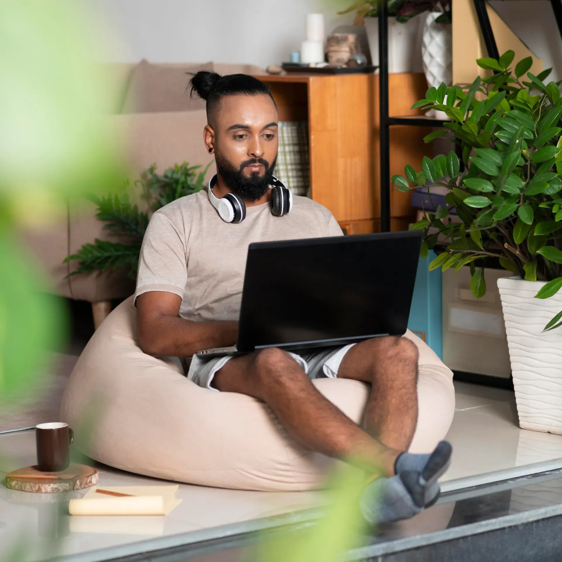 full_shot_man_with_laptop_working.webp