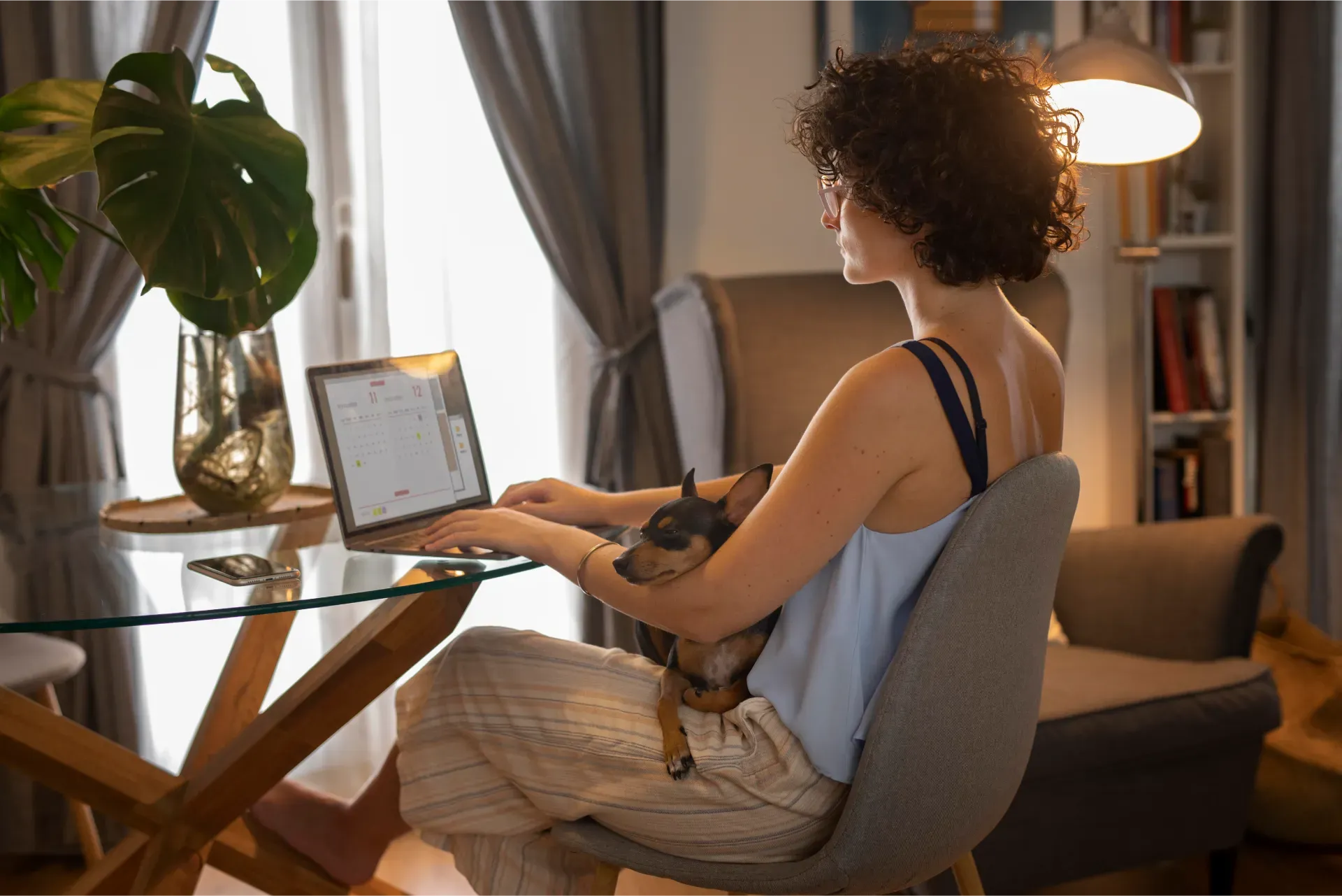 person_working_from_home_with_pet_dog.webp